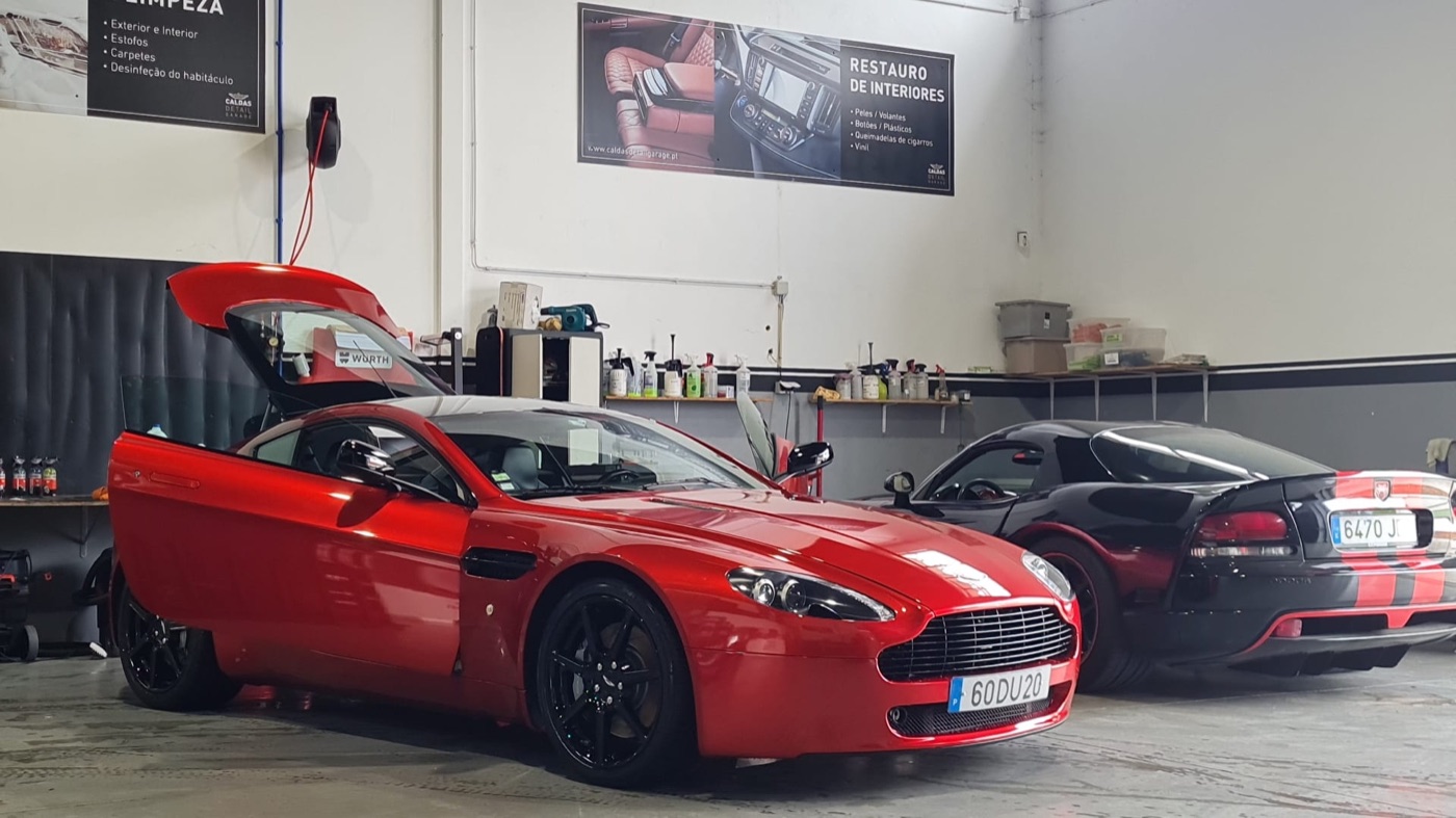 Aston Martin and Dodge Viper after detailing in workshop